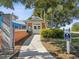 Charming clubhouse featuring colorful exterior, well-manicured landscaping, and inviting seating areas at 525 Manns Harbor Dr, Apollo Beach, FL 33572