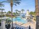 Community pool area with a slide, lounge chairs, and a lighthouse in the background at 525 Manns Harbor Dr, Apollo Beach, FL 33572