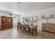 Elegant dining room with a large wood table set for a meal, a chandelier and decor mirrors at 525 Manns Harbor Dr, Apollo Beach, FL 33572