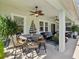 Spacious outdoor patio with comfortable seating and ceiling fans for relaxing at 525 Manns Harbor Dr, Apollo Beach, FL 33572