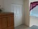 This bedroom features an armoire, bi-fold closet and bright window at 5967 Terrace Park N Dr # 204, St Petersburg, FL 33709