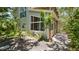 Charming backyard featuring a spacious wood deck, lush greenery, and ample outdoor seating at 6014 Luana S Ln, Gulfport, FL 33707