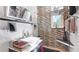 Modern bathroom with sleek fixtures, patterned tile, and a floating vanity at 6014 Luana S Ln, Gulfport, FL 33707