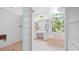 Bathroom features glass block wall shower and soaking tub with view at 6014 Luana S Ln, Gulfport, FL 33707