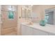 Bathroom boasts dual mirrors, vanity, and a tub-shower combo at 6014 Luana S Ln, Gulfport, FL 33707