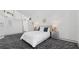 Bright bedroom boasts clean lines and modern decor, complemented by unique patterned flooring at 6014 Luana S Ln, Gulfport, FL 33707