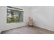 Bright bedroom featuring a sunlit window and a dedicated desk area at 6014 Luana S Ln, Gulfport, FL 33707