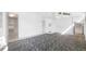 Spacious bedroom with walk-in closet and built-in storage with neutral paint and patterned carpet at 6014 Luana S Ln, Gulfport, FL 33707