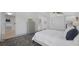 Bright bedroom featuring stylish patterned flooring and an adjacent walk-in closet at 6014 Luana S Ln, Gulfport, FL 33707