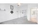 Open bedroom with grey carpet and closet doors at 6014 Luana S Ln, Gulfport, FL 33707