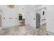 Bright entry foyer with patterned marble floors, contemporary lighting, and an open view into the dining area and kitchen at 6014 Luana S Ln, Gulfport, FL 33707
