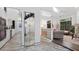 Bright home interior showcasing marble floors, modern staircase, contemporary lighting, and an open floor plan at 6014 Luana S Ln, Gulfport, FL 33707