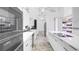 Contemporary kitchen with stainless steel appliances, quartz countertops, and modern fixtures with ample storage at 6014 Luana S Ln, Gulfport, FL 33707