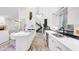 Modern, open-concept kitchen featuring a center island, stainless steel appliances, and sleek cabinetry at 6014 Luana S Ln, Gulfport, FL 33707
