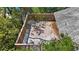 High angle of the spacious wooden deck surrounded by lush trees, creating a private outdoor oasis at 6014 Luana S Ln, Gulfport, FL 33707