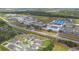 Aerial view of community near schools, baseball field, and tennis courts at 6700 Devlin Ln, Wesley Chapel, FL 33545