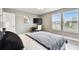 Bright bedroom featuring a bed, desk, and windows offering natural light, creating a welcoming atmosphere at 6700 Devlin Ln, Wesley Chapel, FL 33545