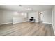 Spacious bonus room with ample natural light, desk space, and modern flooring at 6700 Devlin Ln, Wesley Chapel, FL 33545