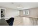 Spacious bonus room with ample natural light, desk space, and modern flooring at 6700 Devlin Ln, Wesley Chapel, FL 33545