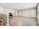 Spacious bonus room with ample natural light, desk space, and modern flooring at 6700 Devlin Ln, Wesley Chapel, FL 33545