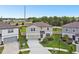 Well-kept home boasting a manicured lawn, tasteful landscaping, and an attached two-car garage at 6700 Devlin Ln, Wesley Chapel, FL 33545