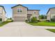 A two-story home in a suburban neighborhood features a well-manicured lawn and a two-car garage at 6700 Devlin Ln, Wesley Chapel, FL 33545