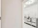 Hallway view with an ornate silver console table featuring a mirror finish at 6700 Devlin Ln, Wesley Chapel, FL 33545