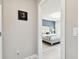Charming main bedroom with a decorative wall, comfortable bed, and elegant lighting at 6700 Devlin Ln, Wesley Chapel, FL 33545