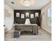 A modern home office featuring a sophisticated desk, a comfortable chair, and stylish animal-themed wall art at 6700 Devlin Ln, Wesley Chapel, FL 33545