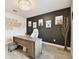 A modern home office featuring a sophisticated desk, a comfortable chair, and stylish animal-themed wall art at 6700 Devlin Ln, Wesley Chapel, FL 33545