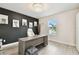 A modern home office featuring a sophisticated desk, a comfortable chair, and stylish animal-themed wall art at 6700 Devlin Ln, Wesley Chapel, FL 33545