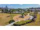 Community playground with slides, climbing structures, and benches offering a safe and enjoyable space for children to play at 6700 Devlin Ln, Wesley Chapel, FL 33545