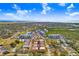 Gorgeous aerial view of the community, showcasing lush landscaping and distant water views at 6823 S Kissimmee St, Tampa, FL 33616