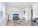 Cozy living room with wood floors, neutral walls, and comfortable furniture; ideal for relaxation at 6823 S Kissimmee St, Tampa, FL 33616