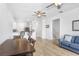 Open-concept living area boasts hard surface floors and seamless flow to the adjacent kitchen and dining at 6823 S Kissimmee St, Tampa, FL 33616