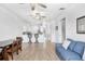 Spacious living area features wood floors, an open layout, and convenient access to the kitchen at 6823 S Kissimmee St, Tampa, FL 33616