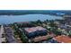 Picturesque aerial view of lakefront property featuring well-maintained condos, complemented by a tranquil lake backdrop at 7903 Seminole Blvd # 2103, Seminole, FL 33772