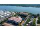Breathtaking aerial view featuring condos, lush landscaping, and access to the lake at 7903 Seminole Blvd # 2103, Seminole, FL 33772
