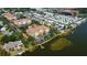 Beautiful aerial view of the lakeside community with pool, docks, and well-manicured landscaping at 7903 Seminole Blvd # 2103, Seminole, FL 33772
