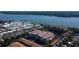 Stunning aerial view of waterfront condos and residential homes near a serene lake, showcasing the prime location and neighborhood at 7903 Seminole Blvd # 2103, Seminole, FL 33772