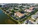 Expansive aerial view of lakeside condos adjacent to a community with a pond and pool, located in a residential neighborhood at 7903 Seminole Blvd # 2103, Seminole, FL 33772