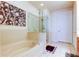 Luxurious bathroom with a soaking tub, glass-enclosed shower, and elegant tile work, providing a spa-like experience at 7903 Seminole Blvd # 2103, Seminole, FL 33772