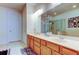 Spacious bathroom featuring a double vanity, glass shower, and large mirror, providing ample space and modern amenities at 7903 Seminole Blvd # 2103, Seminole, FL 33772