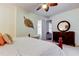 Bedroom with decorative ceiling fan, carpet, iron bed frame, and dresser at 7903 Seminole Blvd # 2103, Seminole, FL 33772