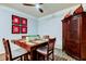 Dining room features a stylish ceiling fan, and modern decor with a wooden dining table at 7903 Seminole Blvd # 2103, Seminole, FL 33772