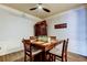 Dining room with stylish ceiling fan, and modern decor with a wooden dining table at 7903 Seminole Blvd # 2103, Seminole, FL 33772