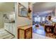 Hallway with tiled floors, decorative cabinet, and a view of the living room at 7903 Seminole Blvd # 2103, Seminole, FL 33772