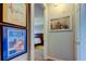 Hallway with colorful posters and a view into a bedroom at 7903 Seminole Blvd # 2103, Seminole, FL 33772