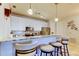 Kitchen bar view featuring stainless steel appliances, marble backsplash, pendant lighting and neutral color scheme at 7903 Seminole Blvd # 2103, Seminole, FL 33772