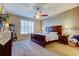 Comfortable bedroom with carpet, ceiling fan, and plantation shutters, showcasing a serene and inviting atmosphere at 7903 Seminole Blvd # 2103, Seminole, FL 33772